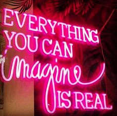 a neon sign that says everything you can imagine is real