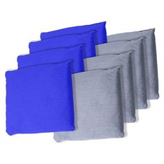 six blue and grey pillows are lined up together