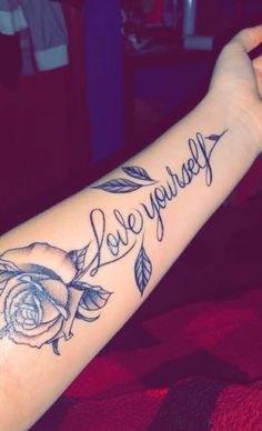 a woman's arm with a rose tattoo and the words i love you so much written on it