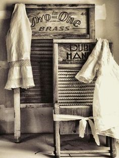 an old fashioned chair sitting in front of a sign