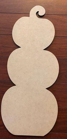 the unfinished paper snowman is cut out and ready to be placed on the table