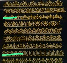 some gold and black designs on a black background with green tape in the middle,