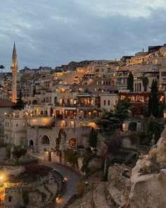 an old city lit up at night with the lights on