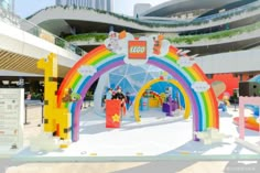 the entrance to a lego store is decorated in rainbow colors