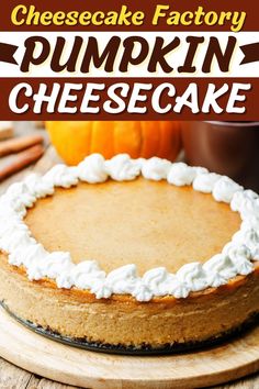 a cheesecake factory pumpkin cheesecake on a wooden board with the words, cheesecake factory pumpkin cheesecake