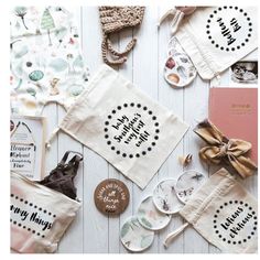 several different types of personalized tea towels on a white table with buttons and tags