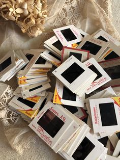 a pile of old photo frames sitting on top of a table