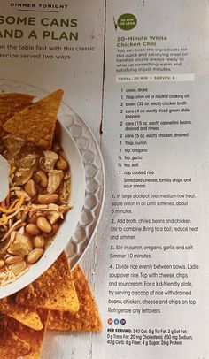 a bowl filled with chips and nuts on top of a plate next to some tortilla chips