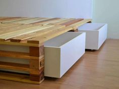 a table made out of wood and white drawers