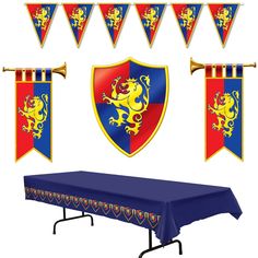 an image of a table set up for a birthday party with flags and banners in the shape of lions