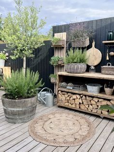 an outdoor area with potted plants and wooden shelves