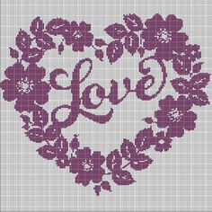 a cross stitch heart with flowers and the word love written in cursive writing