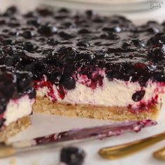 a blueberry cheesecake is cut into slices