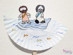 a paper plate with an image of two people sitting on top of a boat in the water