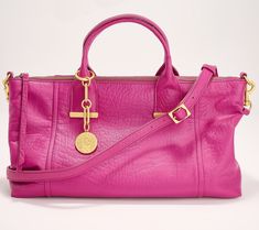 Make this soft leather beauty your everyday handbag. Goldtone accents elevate this casual style. The lined interior features multiple pockets for organization, and the dangle accessory provides a glam finishing touch. From Vince Camuto. Handbags 2024 Trends, Everyday Handbag, Pack Light, Overnight Bags, Navy Fashion, Makeup Bags, Packing Light, Overnight Bag, Arm Candy