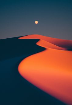 the moon shines brightly in the sky over sand dunes at dusk, with an orange glow