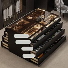 an overhead view of a kitchen with drawers and counter tops in black, white and grey