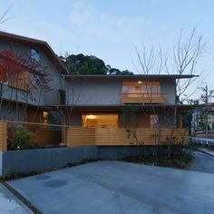 a modern house with wood siding and windows