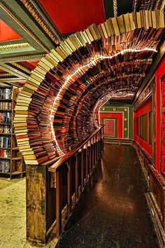 the inside of a library with many books on shelves