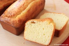 two loaves of bread sitting on top of a cutting board