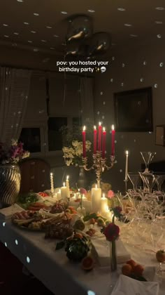 a table with candles and food on it