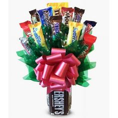 a bouquet of candy wrapped in cellophane and tied with a bow on top