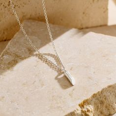 The Mini Flow Bar Sterling Silver Necklace is the epitome of dainty elegance. This delicate piece features a slim, vertical bar pendant that gracefully rests on a fine chain, creating a minimalist look that exudes subtle sophistication. Its refined design makes it the perfect accessory for layering or wearing alone, adding just the right touch of shine to any outfit.   Crafted with a keen eye for detail, the Mini Flow Bar Sterling Silver Necklace offers a gentle yet stylish statement, ideal for Posh Totty, Vertical Bar, August Birthstone Jewelry, July Birthstone Jewelry, Creating Jewelry, Jewelry Ring Box, Pearl Jewellery Earrings, Bar Pendant, Men's Jewelry Rings