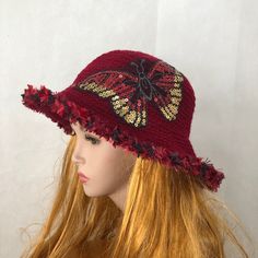 I created this beautiful hat in a dramatic combination of crimson red and golden colors.  Tightly crocheted red hat I decorated with big, shiny, sequined red, silver and gold butterfly. The hat is unique, well done and beautiful. It is a statement hat, which will attract a lot of attention and compliments. Fits most of average and big  adults heads. Comes from my smoke and pet free studio. There are more hats here: http://www.etsy.com/shop/Iryna?section_id=5059710 Send me a message if you need more information about this hat or any other item in my shop. Best wishes  from Iryna Handmade Red Party Hat, Red Crochet Wide Brim Hat, Red Wide Brim Crochet Hat, Brimmed Yarn Bucket Hat, Red Crochet Hat For Spring, Red Brimmed Crochet Hat For Spring, Red Wide Brim Crochet Hat For Spring, Burgundy Wide Brim Hat For Summer, Adjustable Crochet Party Hat