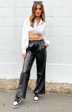 Black PU Leather Pants Fierce and bold! Pair with a white crop and some sneakers for a super cool model-off-duty look High waisted Elastic waistband Two functioning front pockets Fitted waist with wide leg Soft interior Boutique Pants, Shop Pants, Summer Playsuit, Sweater Crop, Strapless Tops, Crop Top Sweater, One Shoulder Tops, White Crop