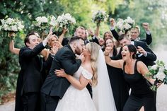 a bride and groom are surrounded by their wedding party