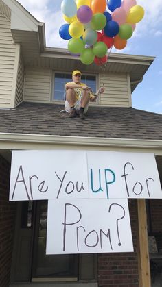 a sign that says are you up for prom? on the roof of a house