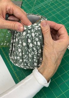 the person is working on an origami object