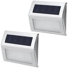 two white solar powered motion sensor lights