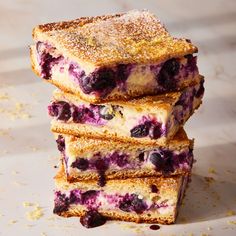 blueberry cheesecake bars stacked on top of each other