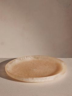 a white plate sitting on top of a table