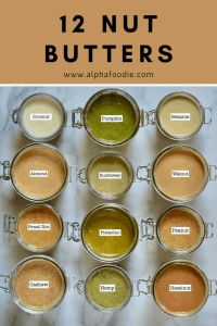 twelve jars filled with different types of peanut butter