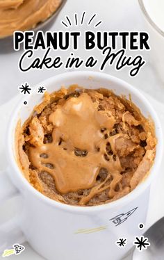 peanut butter cake in a mug with frosting on top and the words, peanut butter cake in a mug