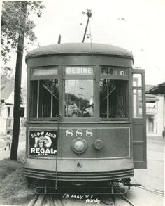 an old black and white photo of a trolley car