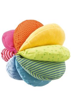 four pillows stacked on top of each other in the shape of an apple, orange, yellow and blue