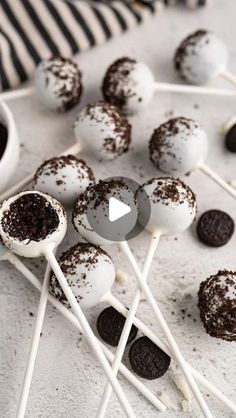 chocolate cake pops with oreo cookies on top and white marshmallows in the middle