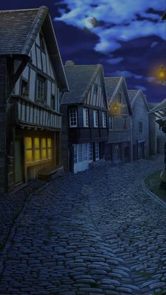 a cobblestone street at night with the moon in the sky and buildings on either side