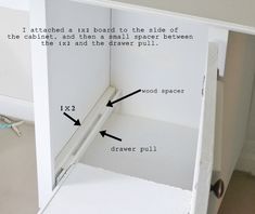 the inside of a white cabinet with measurements and instructions on how to put it in