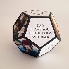 an origami cube with photos on it and the words dad i love you to the moon and back