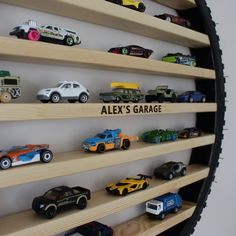 there are many toy cars on the shelves