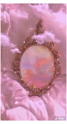 a mirror with clouds and stars in the sky above it, as if for an art project