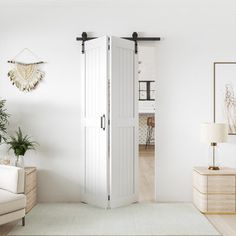 a living room with white walls and furniture