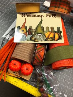 there is a sign that says welcome fall and some pumpkins are on the table