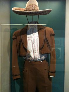 a display case with a hat and suit on it