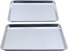 two metal trays sitting next to each other