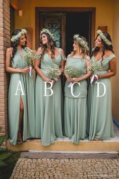 the bridesmaids are all dressed in mint green gowns and flower crowns for their wedding